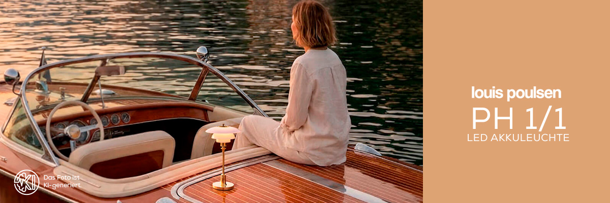 Louis Poulsen PH 1/1 rechargeable LED table lamp on a classic boat by the water