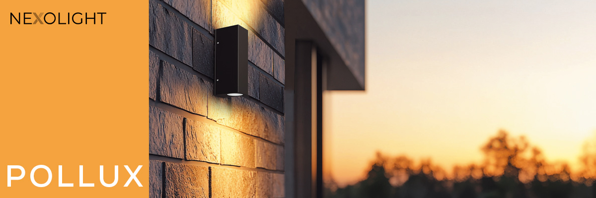 Nexolight Pollux outdoor wall light with up and down light on a modern brick facade at sunset