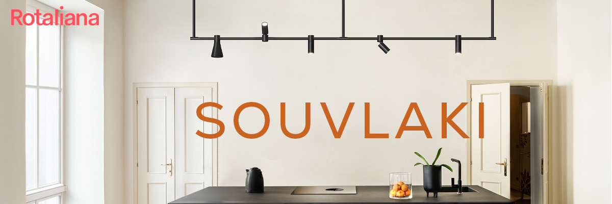 Rotaliana Souvlaki lighting system with flexible LED spotlights above a modern kitchen island