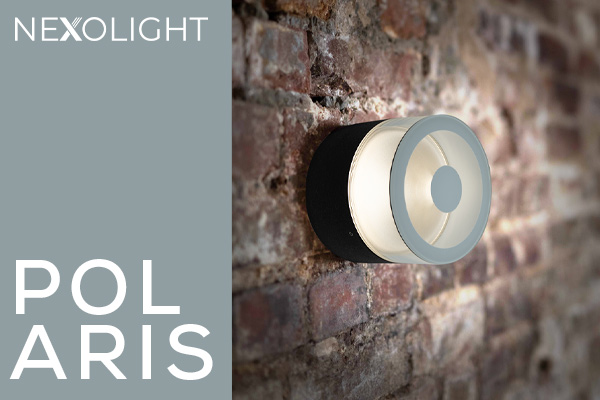 Nexolight Polaris outdoor wall light with round body on a modern brick facade