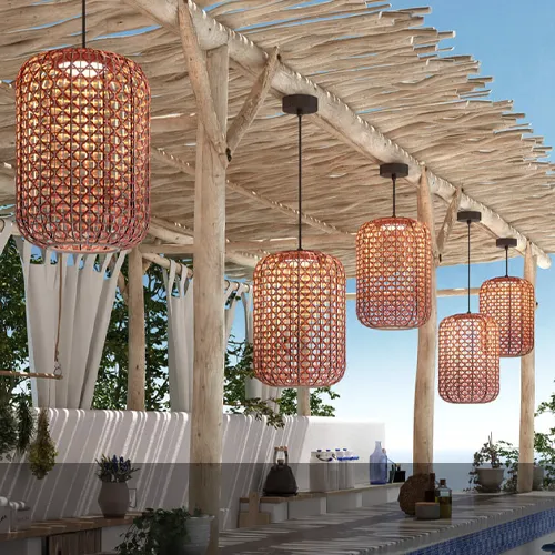 Bover Nans outdoor pendant lights with woven shades above a Mediterranean terrace bar