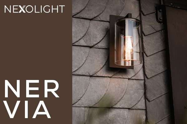 Nexolight Nervia outdoor wall light with glass cylinder and warm light on a slate facade